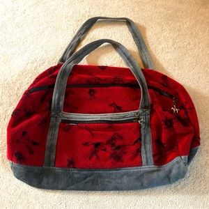 Dark red with black horse pattern Tsunami  brand fleece duffel bag